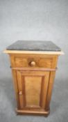 A late 19th century French walnut pedestal cabinet with marble top above frieze drawer and panel