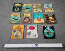 A collection of twelve vintage Tintin comics. H.31 W.23