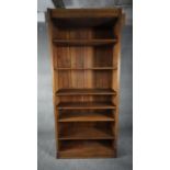 A full height oak open bookcase section with adjustable shelves. H.228 W.101 D.32