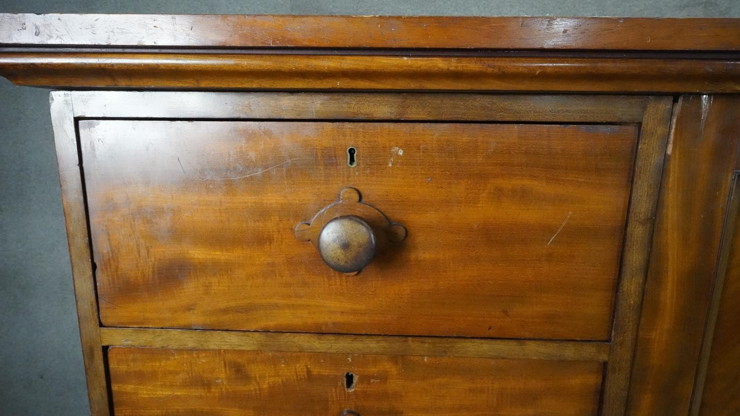 An mid 19th century mahogany linen cupboard with central panel doors flanked by two banks of four - Image 3 of 14