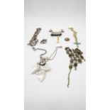 A collection of costume jewellery. Including an agate cabochon mesh link necklace, a stylised floral