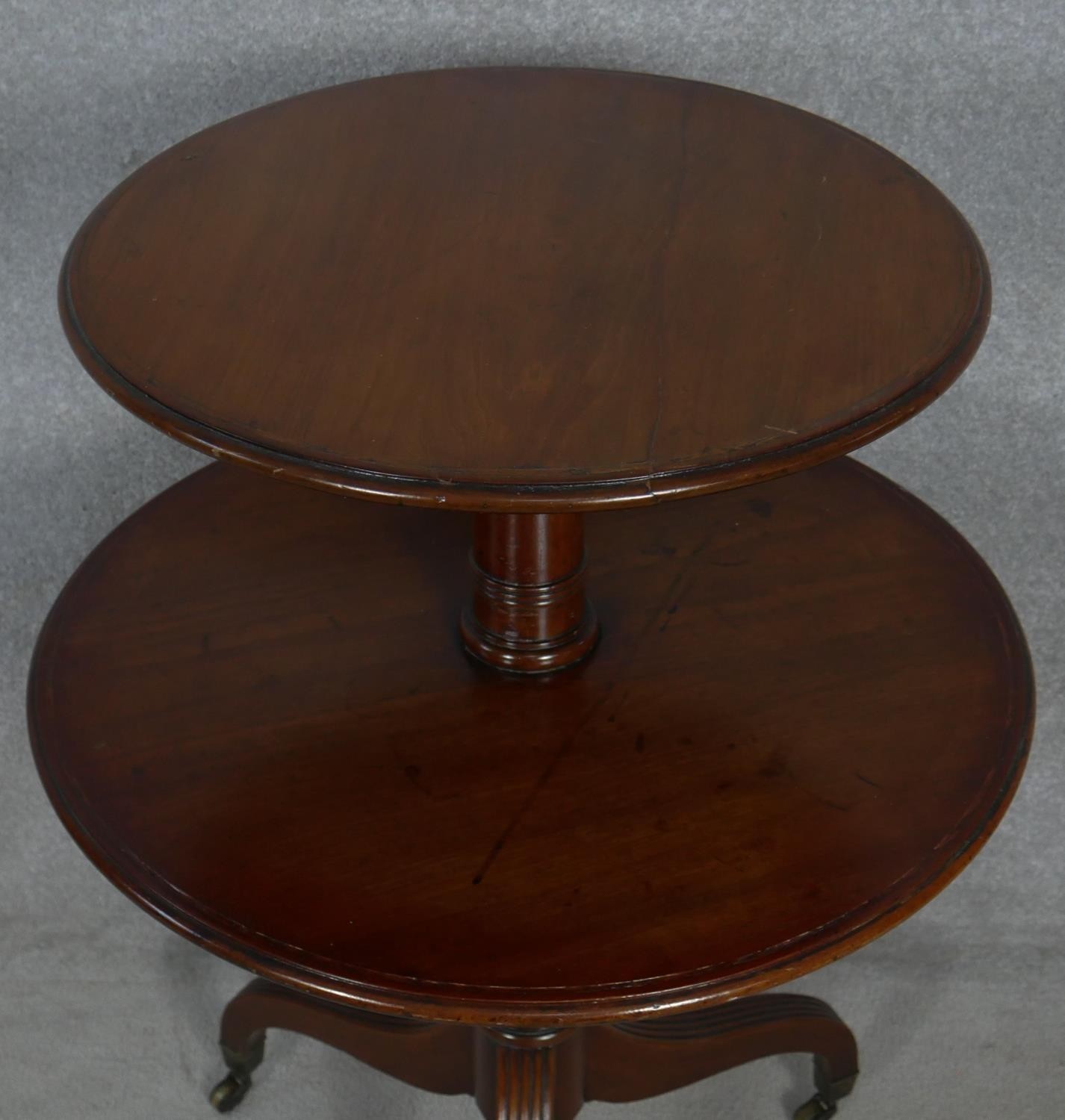 A late Georgian mahogany two tier dumb waiter on turned column and reeded tripod supports - Image 2 of 4