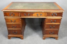 A Georgian style mahogany three section desk with inset leather top on bracket feet. h.78 w.122 d.62