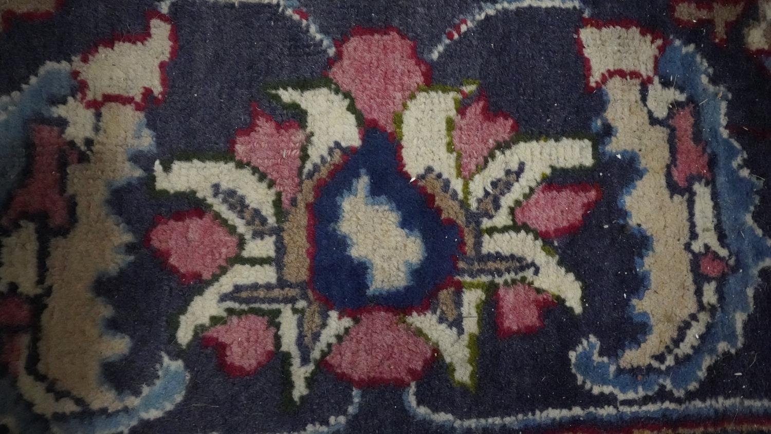 A Persian Mershed carpet with central medallion within a blue foliate border. H.330 W.242 - Image 5 of 5