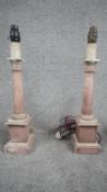 A pair of vintage painted wooden marble effect column table lights on rectangular ridged bases. With