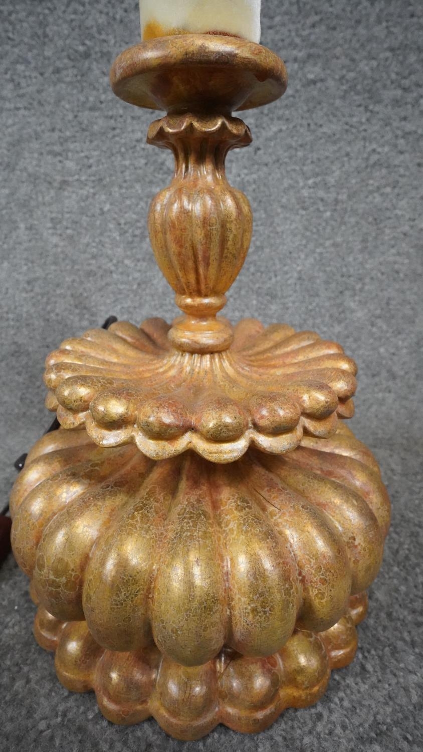 Three carved wooden and gilded table lamps. Including one with a stylised floral design. H.38 - Image 10 of 16