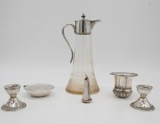 A collection of silver and silver plate. Including a pair of weighted silver candlesticks, a white