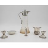 A collection of silver and silver plate. Including a pair of weighted silver candlesticks, a white