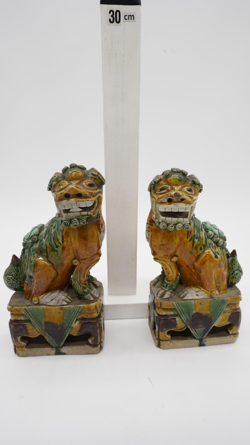 A pair of Sancai Kangxi style late Qing ceramic Foo dogs with green and yellow glaze. Unmarked. H.19 - Image 6 of 7