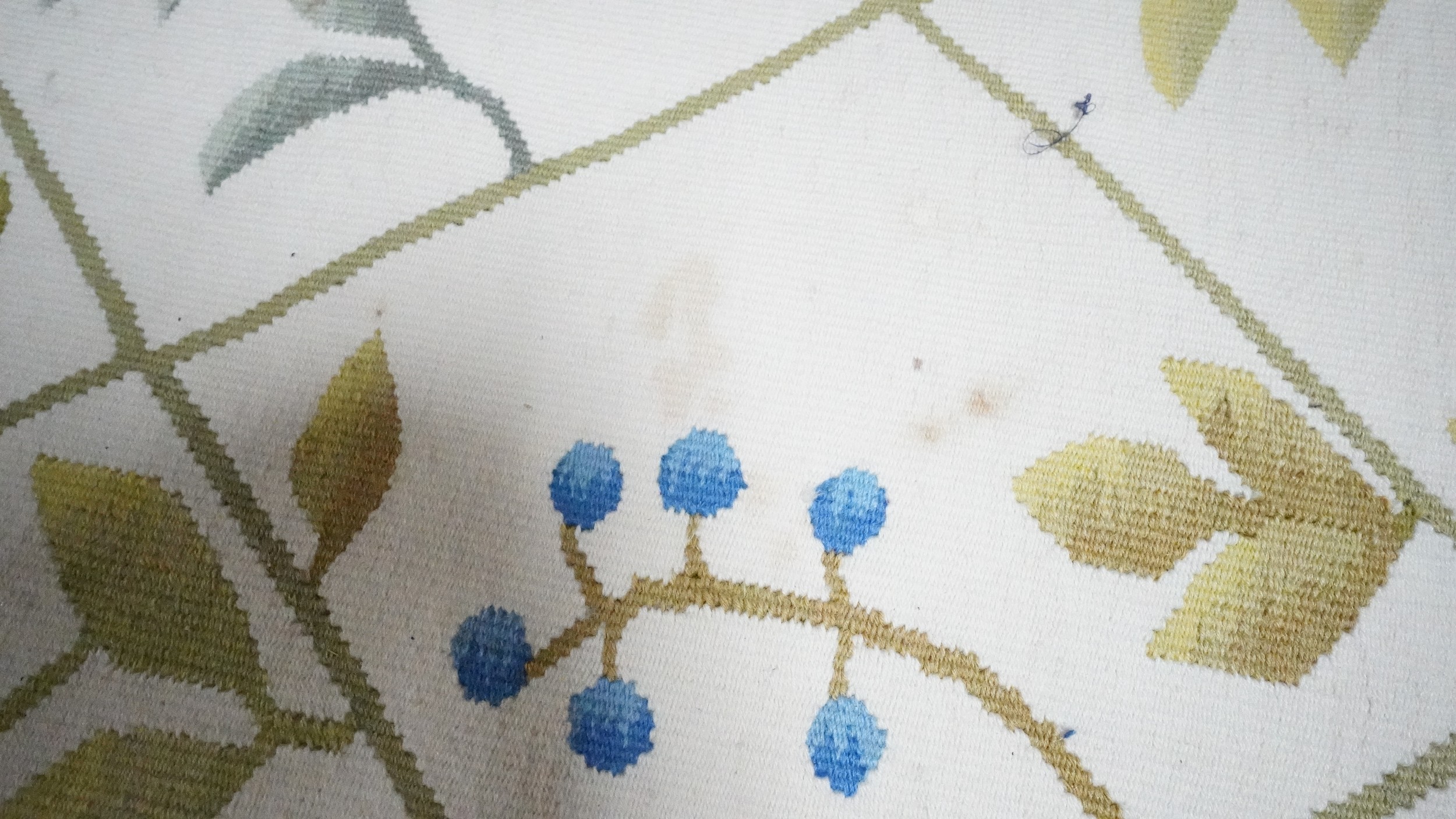A needlepoint carpet on a cream ground within a floral border. H.258 W.256 - Image 7 of 7