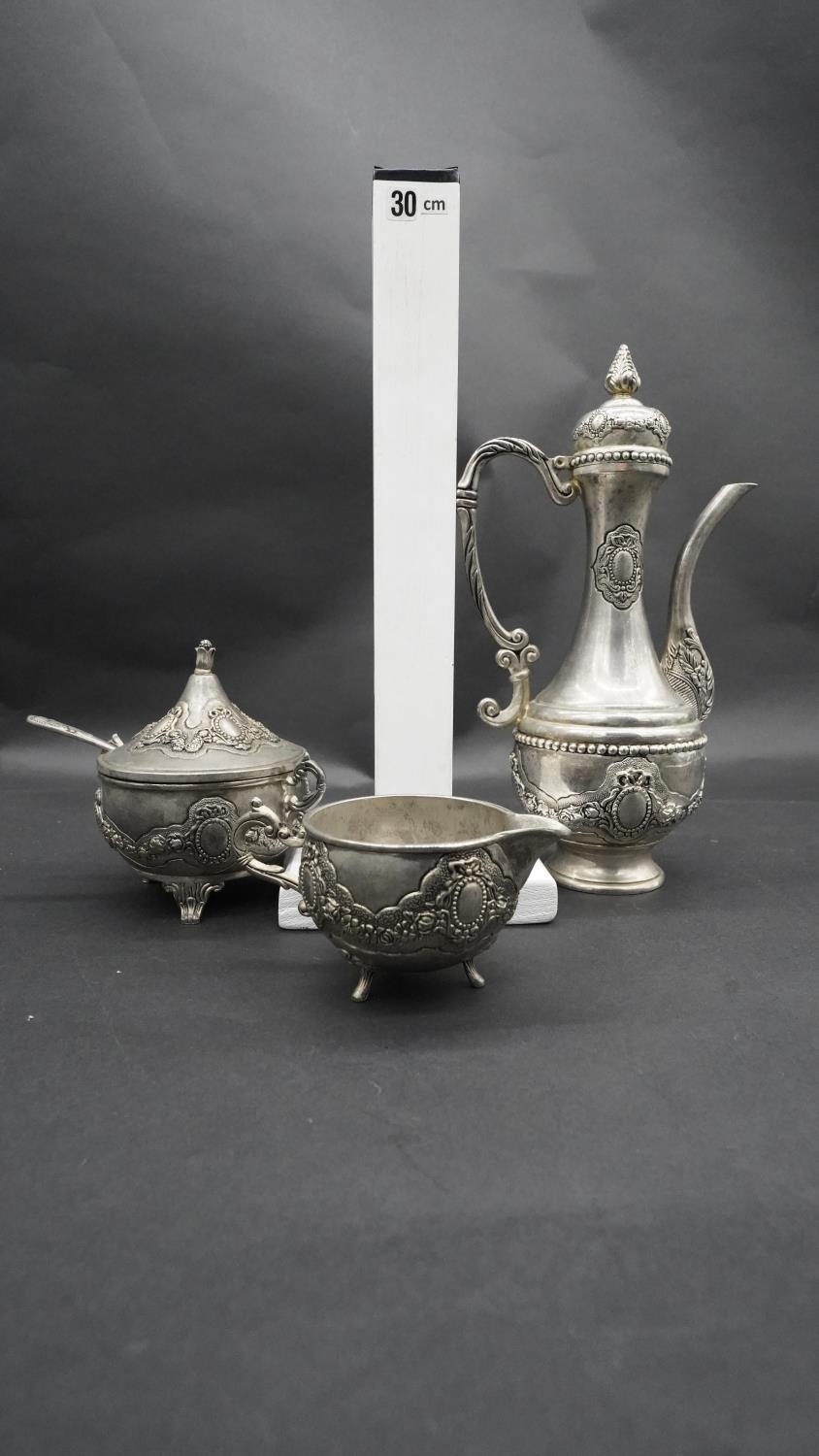 A silver plate relief swag and floral design three piece Islamic coffee set, with coffee jug, - Image 3 of 11