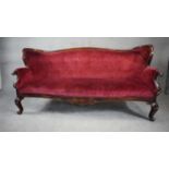 A late 19th century stained birch framed sofa in cut floral upholstery on cabriole supports. H.105