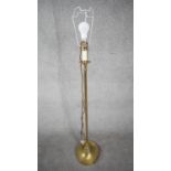 A vintage solid brass weighted base height adjustable standard lamp with silk wrapped cord. H.124