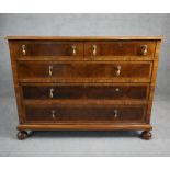 A William and Mary style oyster veneer chest with walnut crossbanding and satinwood stringing and
