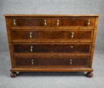 A William and Mary style oyster veneer chest with walnut crossbanding and satinwood stringing and