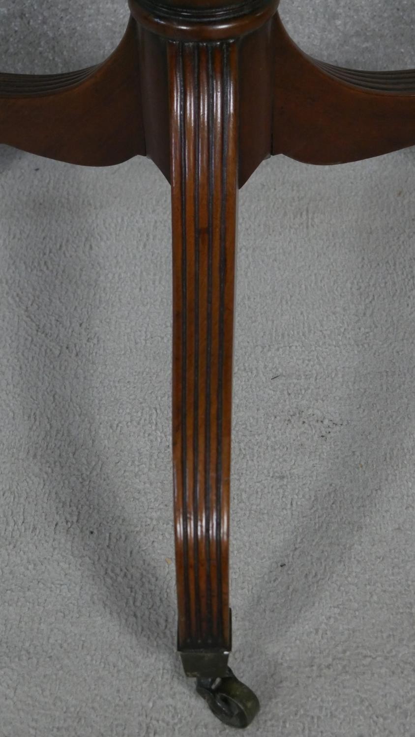 A late Georgian mahogany two tier dumb waiter on turned column and reeded tripod supports - Image 3 of 4