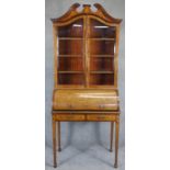 An Edwardian mahogany cylinder bureau bookcase with profuse all over satinwood Ho Ho bird, dragon,