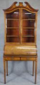 An Edwardian mahogany cylinder bureau bookcase with profuse all over satinwood Ho Ho bird, dragon,