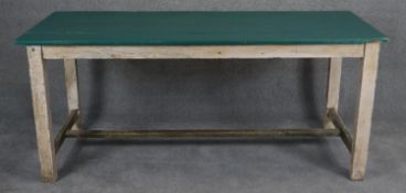 A vintage distressed painted planked top kitchen dining table on square stretchered supports. H.78