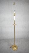 A vintage solid brass candle design height adjustable standard lamp with ridged circular base. H.160
