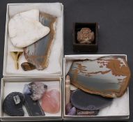 A collection of mineral samples. Inlcuding Obsidian, picture marble, soapstone, rose quartz.