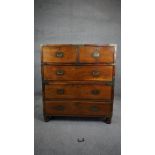 A 19th century camphorwood two part brass bound military chest with brass inset handles and twin