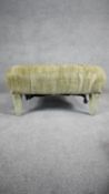 A footstool in deep, purple floral buttoned upholstery on square tapering supports. H.42 W.73 D.73