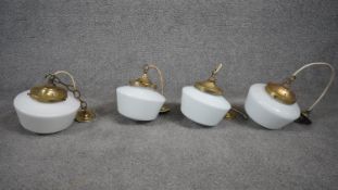 Four Art Deco milk glass shade conical design ceiling lamps with pierced brass fittings. H.26
