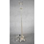 A vintage silver plated height adjustable two bulb standard lamp with reeded column, X-shape base