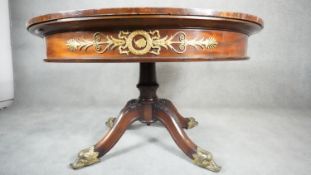 A Continental style mahogany occasional table with tooled and gilded leather inset top and ormolu