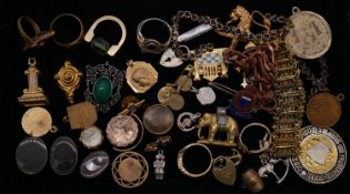 A collection of jewellery. Including a charm bracelet with heart padlock, various rings, a