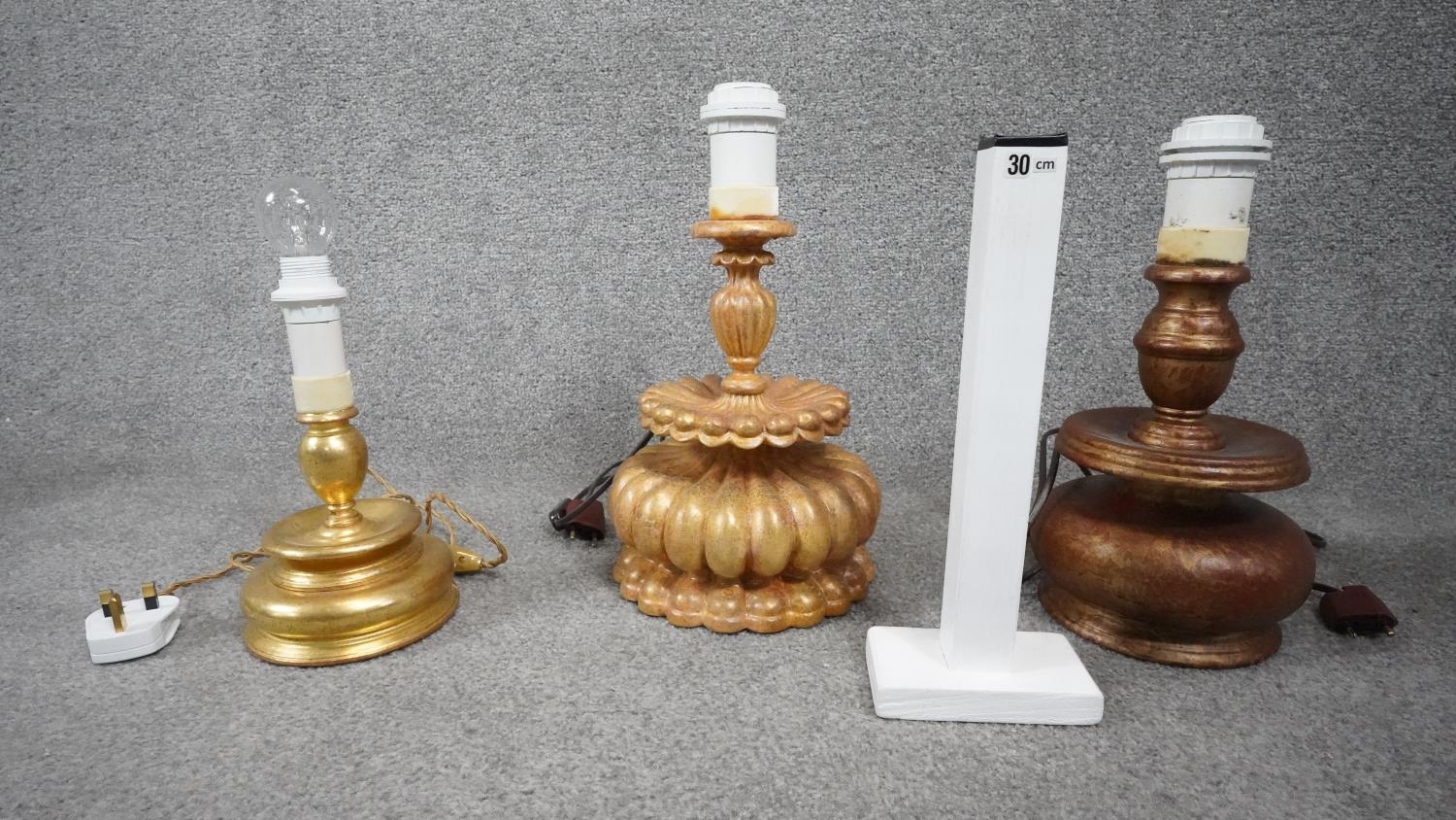 Three carved wooden and gilded table lamps. Including one with a stylised floral design. H.38 - Image 6 of 16