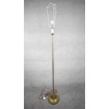 A vintage solid brass candle design height adjustable standard lamp with ridged circular base. H.172