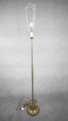 A vintage solid brass candle design height adjustable standard lamp with ridged circular base. H.172