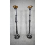 A pair of large Arts and Crafts wrought iron and brass floor standing candle holder/planters. H.