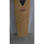 A box framed Wormwood 'The Wand' cricket bat signed and inscribed by England cricketer Andrew