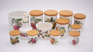 A collection of ten Portmeirion Pomona design storage jars, two cachepots and a soap dispenser.