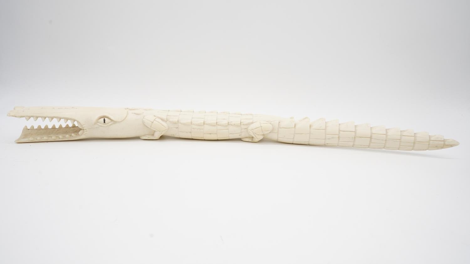 A 19th century carved ivory crocodile. H.5 W.63