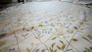 A needlepoint carpet on a cream ground within a floral border. H.258 W.256