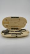 A 19th century French ivory cased pocket sewing kit complete with all components to include needle