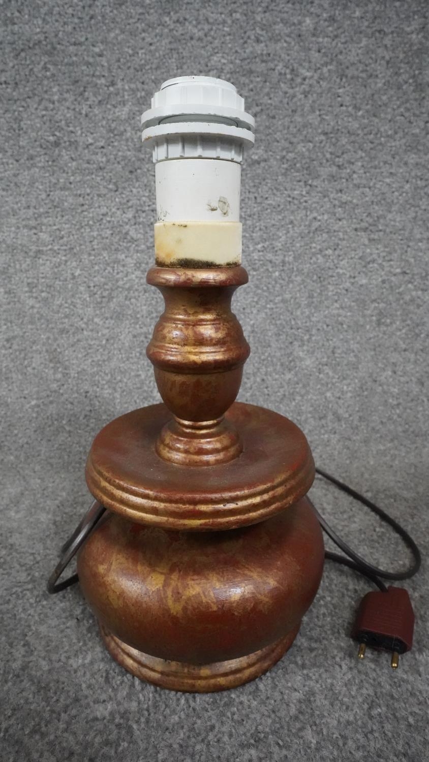 Three carved wooden and gilded table lamps. Including one with a stylised floral design. H.38 - Image 12 of 16