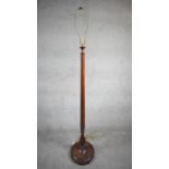 A vintage mahogany standard lamp on platform base. H.186