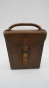 An antique tan leather cased James Dixon & Sons hunting saddle canteen set. Comprising of locking