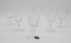 A boxed set of six Royal Osbourne cut lead crystal wine glasses with star cut bases, with labels and