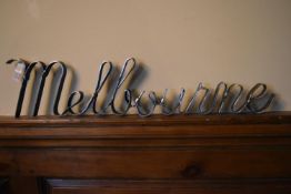 A wrought metal sign: Melbourne. H.15 W.60 D.4cm