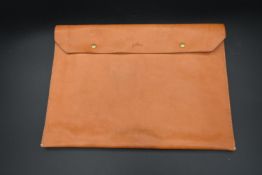 A Dan Genten light tan leather documents clutch wallet, impressed with maker's name and with label