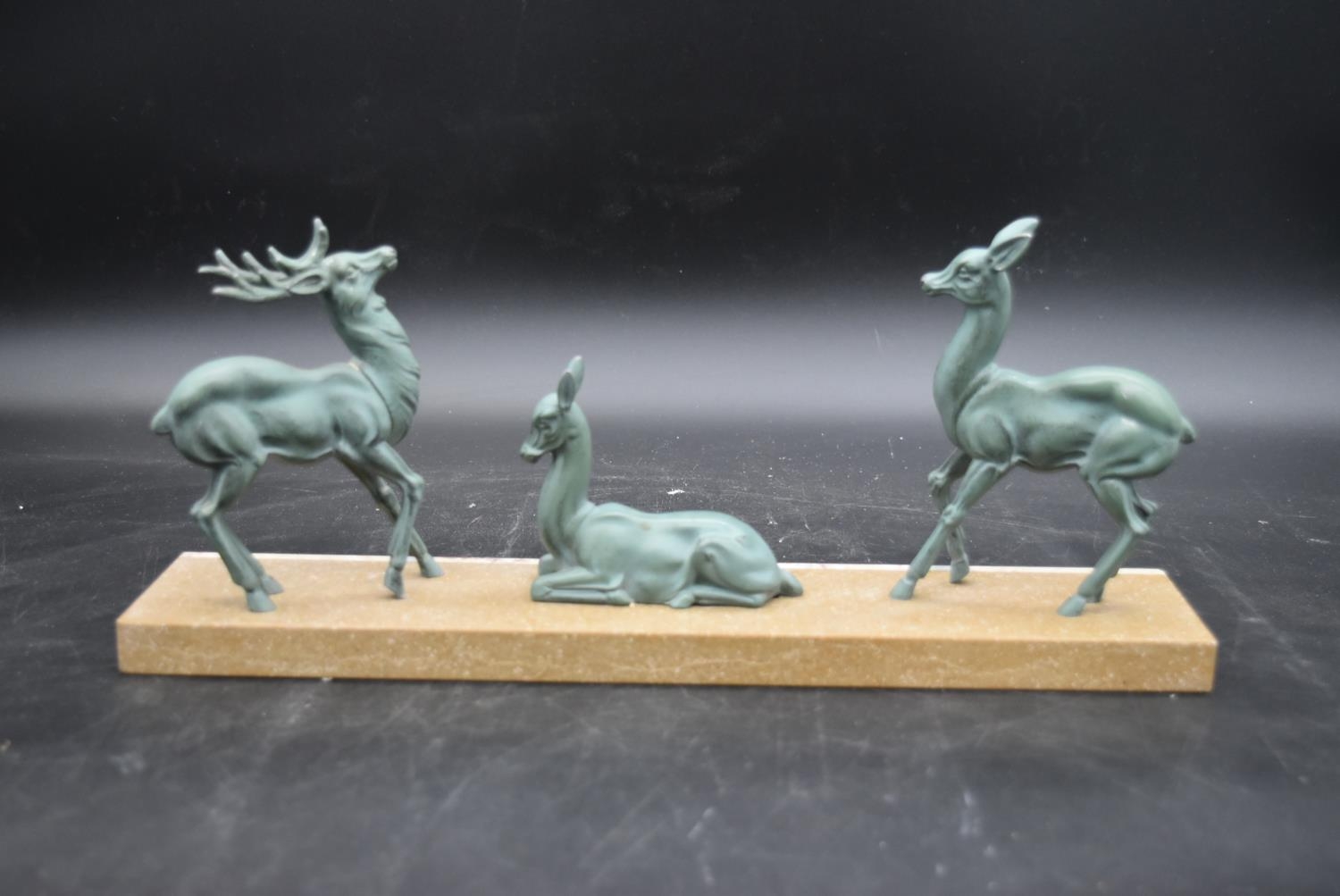 An Art Deco bronze figure group, deer and a stag, on marble base. H.16 W.40