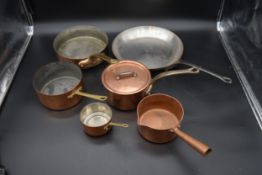 A collection of six miscellaneous vintage copper and brass pans along with a galvanised metal