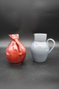 A collection of glazed Studio Pottery, viz; two jugs, a twin handled urn and a vase. H.22cm Dia.15cm