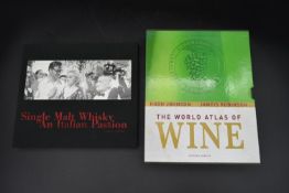 The sixth edition of The World Atlas of Wine by Hugh Johnson along with Single Malt Whiskey an